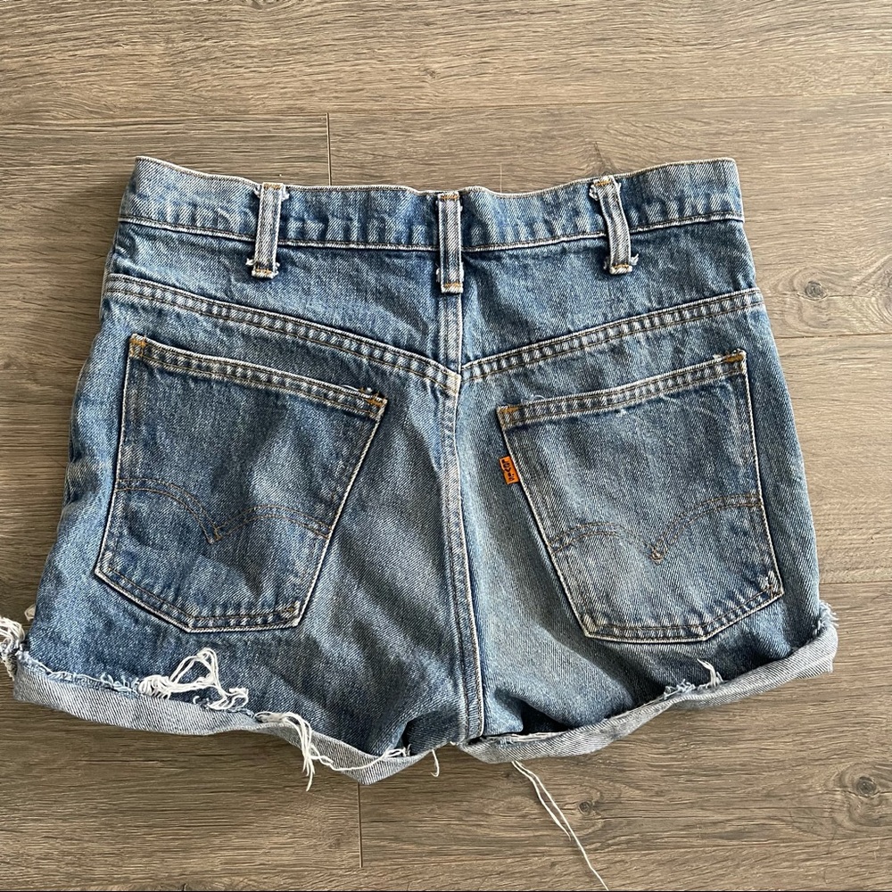 Vintage orange tag Levi’s high rise cutoff Jean shorts  . Size 28